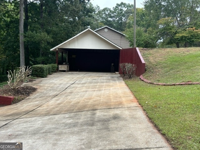 garage featuring a lawn