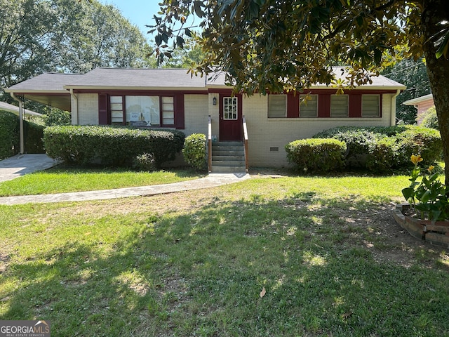 ranch-style home with a carport and a front yard