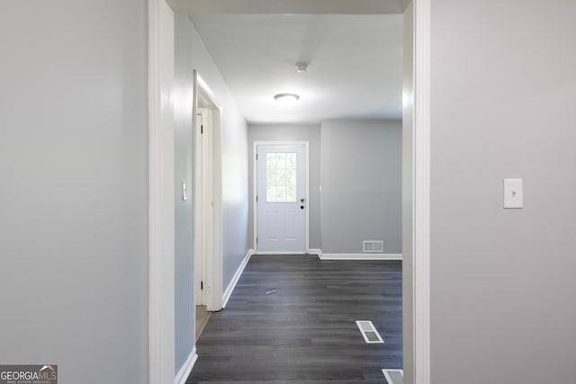 corridor featuring dark hardwood / wood-style flooring