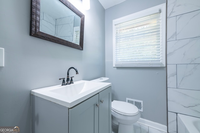 bathroom with tile patterned flooring, toilet, and vanity