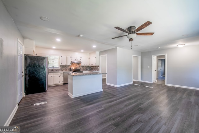 kitchen featuring white cabinetry, ceiling fan, dark hardwood / wood-style floors, appliances with stainless steel finishes, and sink