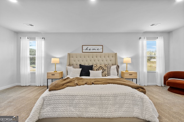 bedroom featuring light colored carpet