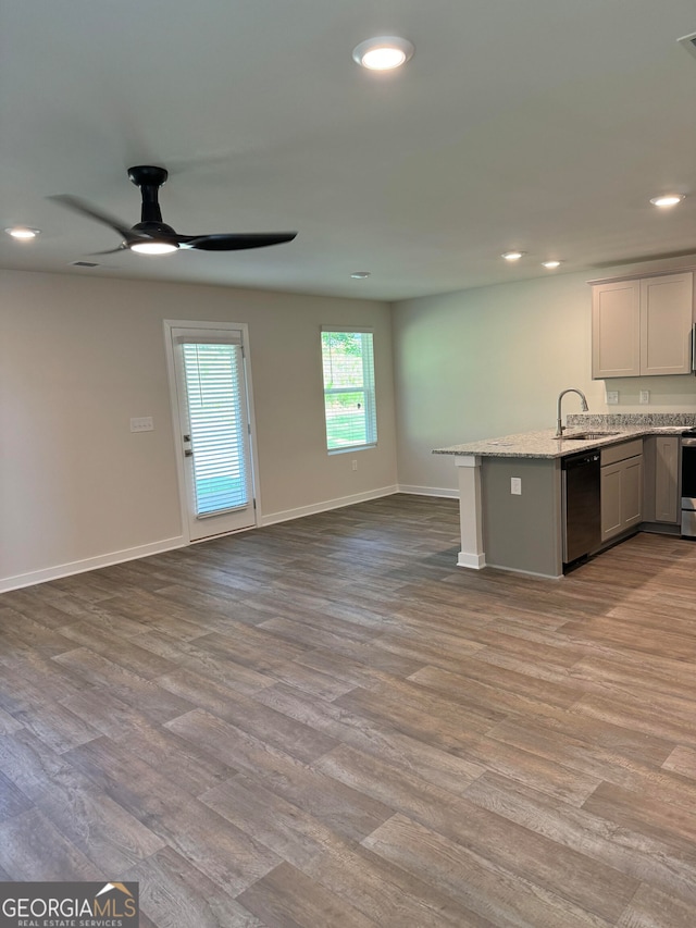 kitchen with ceiling fan, white cabinets, stainless steel appliances, and light wood-type flooring