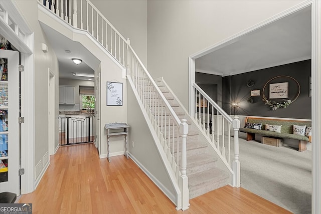 staircase featuring light wood-type flooring