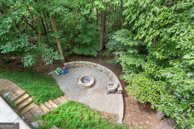 exterior space featuring a patio and an outdoor fire pit