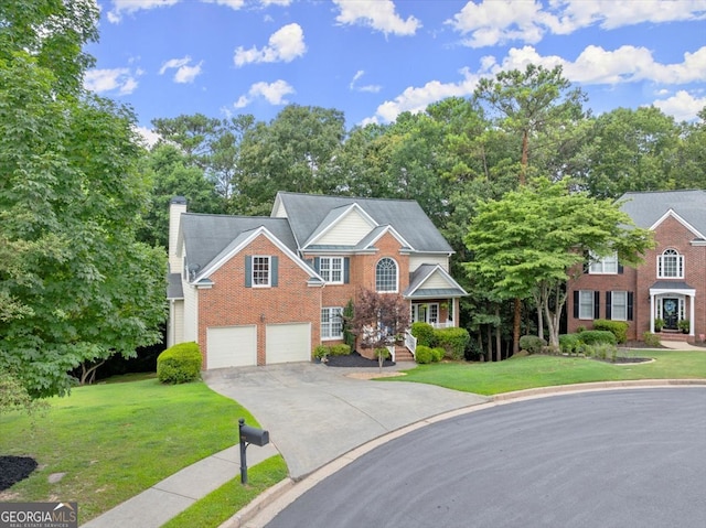 view of front of house with a garage and a front yard