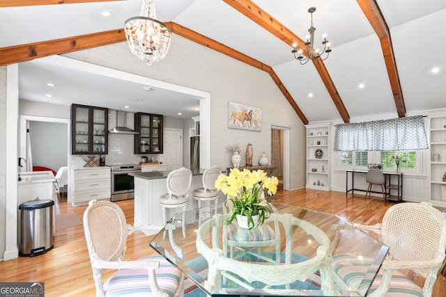 dining area with an inviting chandelier, lofted ceiling with beams, built in features, and light wood finished floors