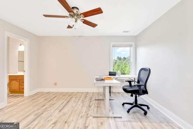 office area featuring light hardwood / wood-style floors and ceiling fan