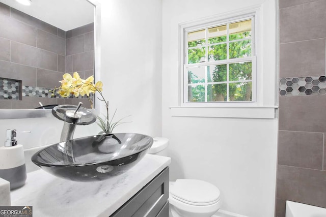 bathroom featuring vanity and toilet