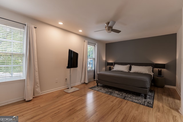 bedroom featuring light wood-type flooring and ceiling fan