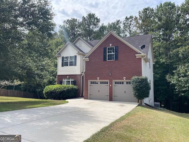 view of front of house featuring a garage and a front yard