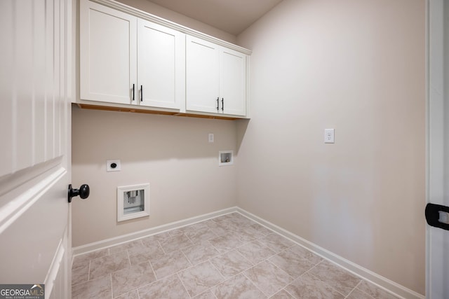 laundry room featuring electric dryer hookup, cabinets, and washer hookup