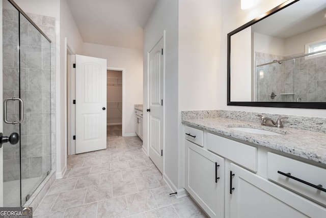 bathroom with vanity and walk in shower