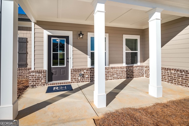 doorway to property with a porch