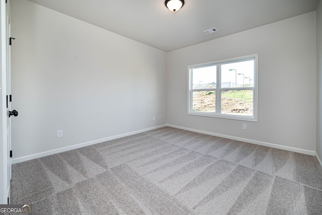 spare room featuring carpet flooring