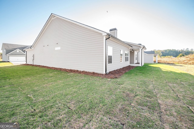 view of home's exterior with a yard