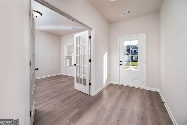 foyer with light wood-type flooring