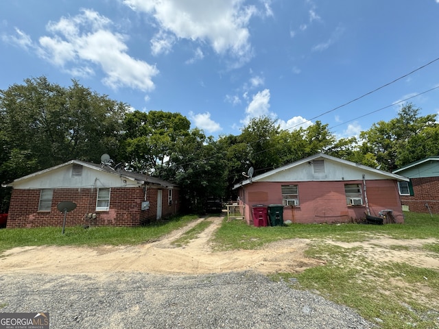 view of side of home featuring cooling unit