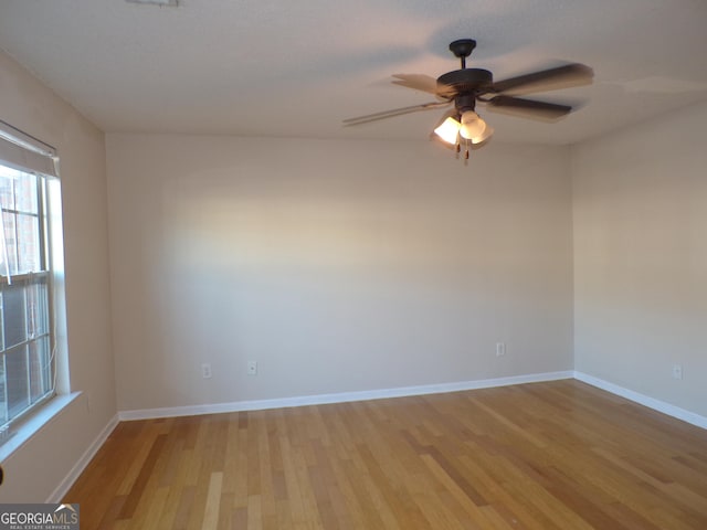 unfurnished room with ceiling fan and light hardwood / wood-style flooring