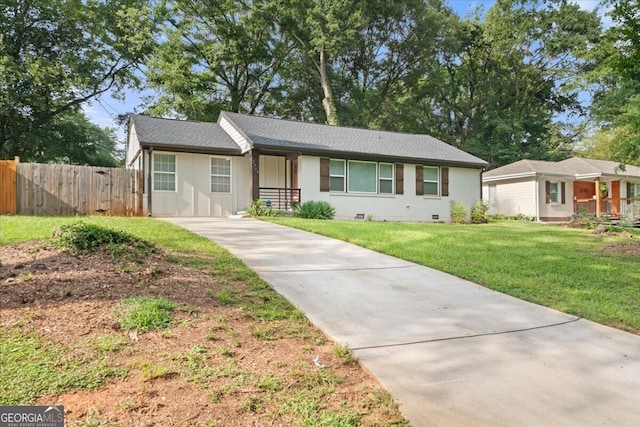 ranch-style home with a front yard