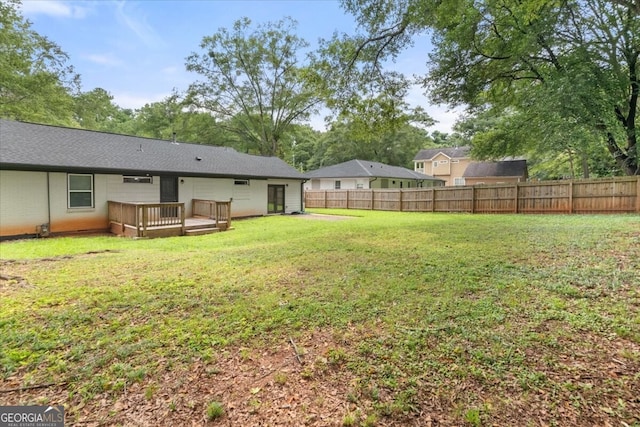 view of yard with a wooden deck