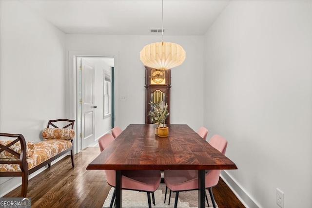 dining room with hardwood / wood-style floors