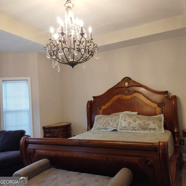 bedroom with a chandelier