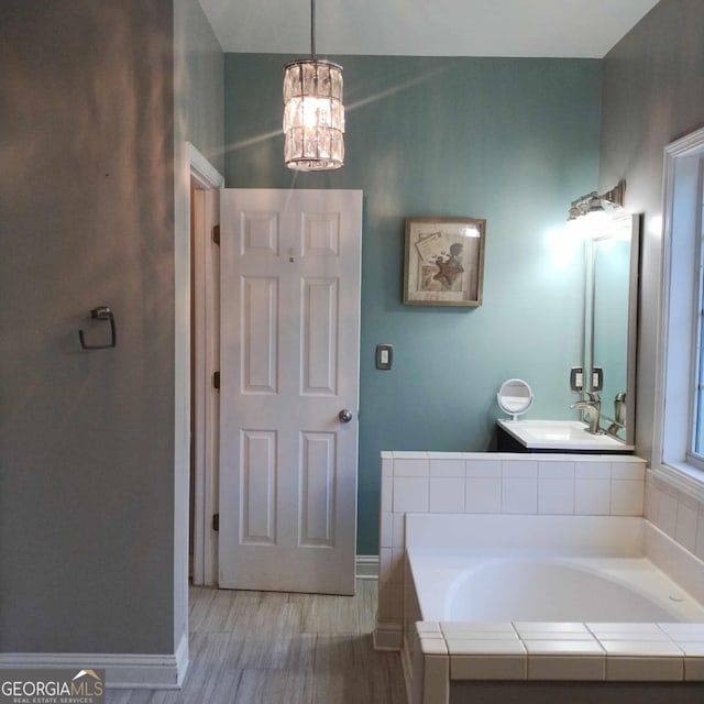 bathroom with tiled bath