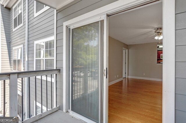 exterior space featuring ceiling fan