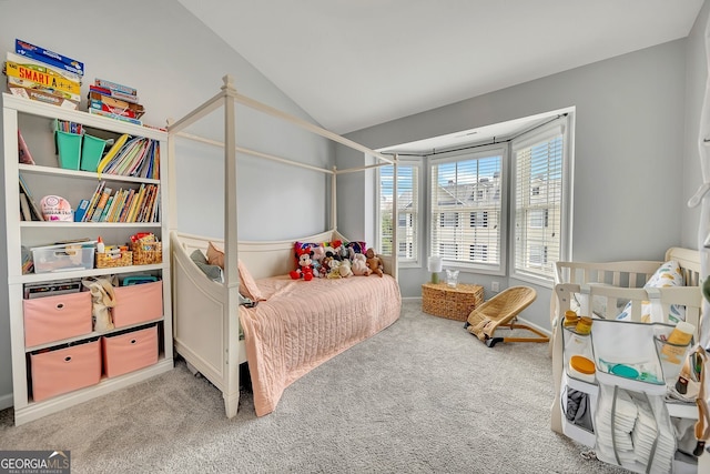 carpeted bedroom featuring vaulted ceiling