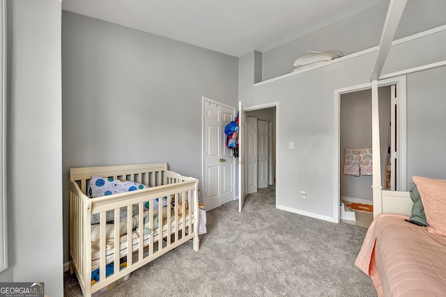 bedroom with carpet floors and a crib