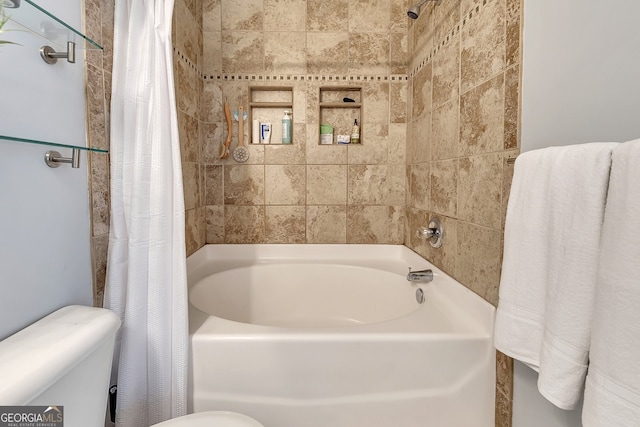 bathroom with shower / tub combo with curtain and toilet