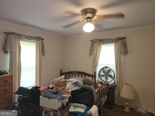 bedroom featuring ornamental molding and ceiling fan