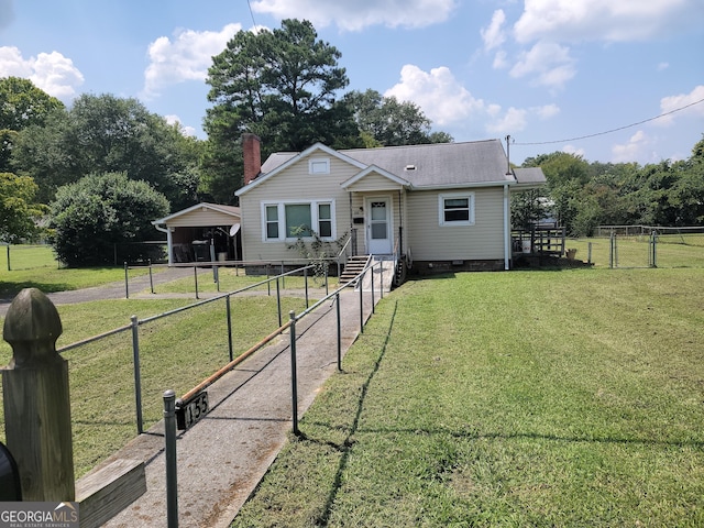 bungalow-style house with fence, crawl space, a detached carport, a chimney, and a front yard