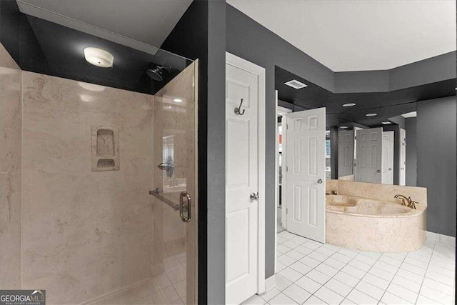 full bathroom featuring visible vents, a garden tub, a shower stall, and tile patterned floors