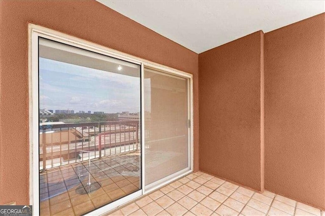 entryway with a city view and tile patterned floors