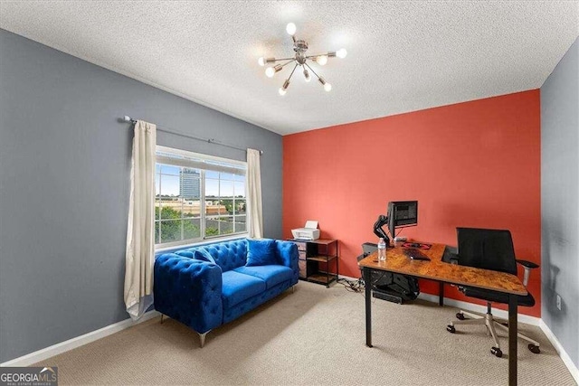 office area featuring baseboards, a textured ceiling, carpet, and an inviting chandelier