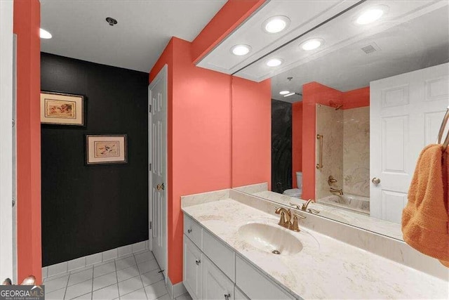 full bath with toilet, vanity, shower / tub combination, tile patterned flooring, and baseboards