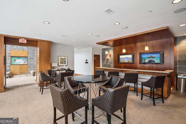 dining space featuring light colored carpet