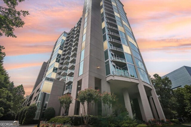 view of outdoor building at dusk