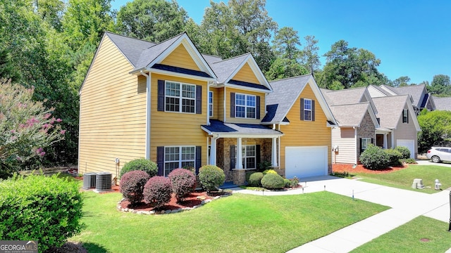 view of front of property featuring a garage and a front yard