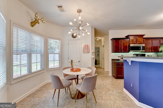 dining area featuring a chandelier