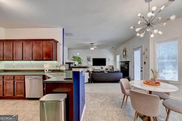 kitchen with pendant lighting, ceiling fan with notable chandelier, dishwasher, kitchen peninsula, and sink