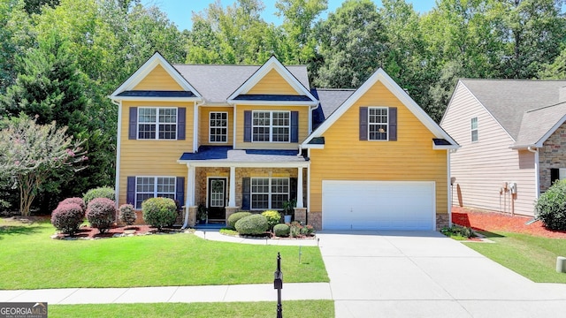 craftsman-style house featuring a garage and a front lawn