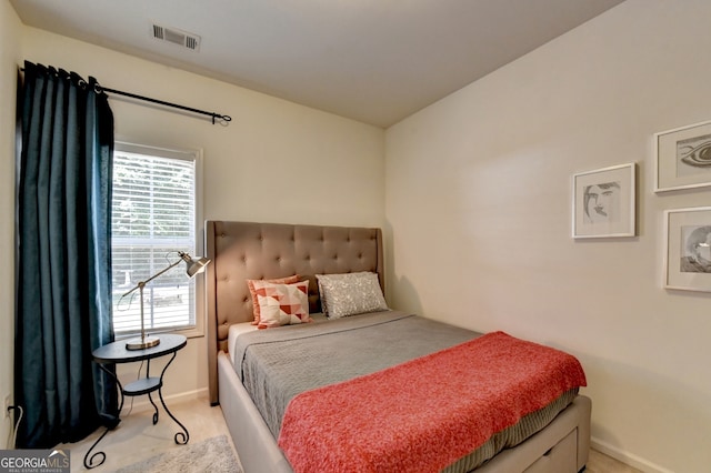 bedroom featuring light carpet