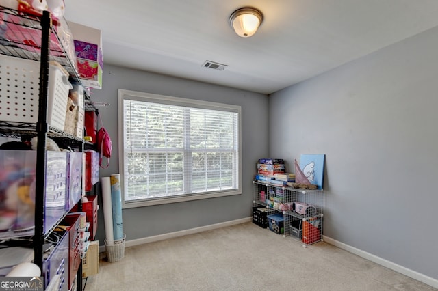 interior space featuring light colored carpet