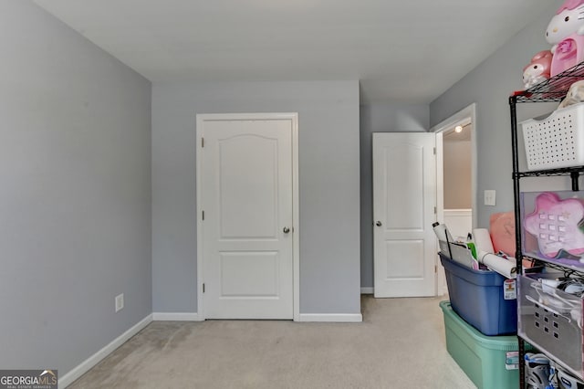 unfurnished bedroom featuring light colored carpet