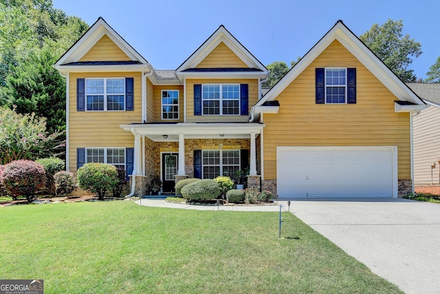 craftsman inspired home with a garage and a front lawn