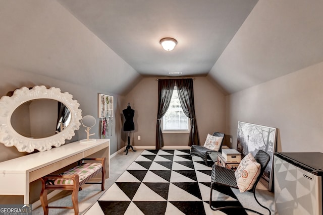 interior space with light colored carpet and vaulted ceiling