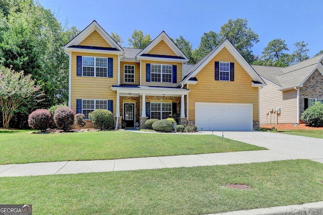 view of front of property featuring a garage and a front lawn